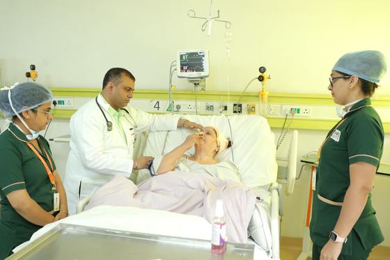 The nursing team attending a patient