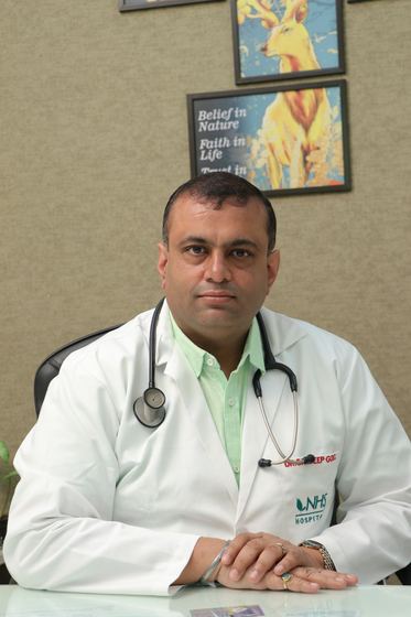 A consultant in clinic at NHS Hospital