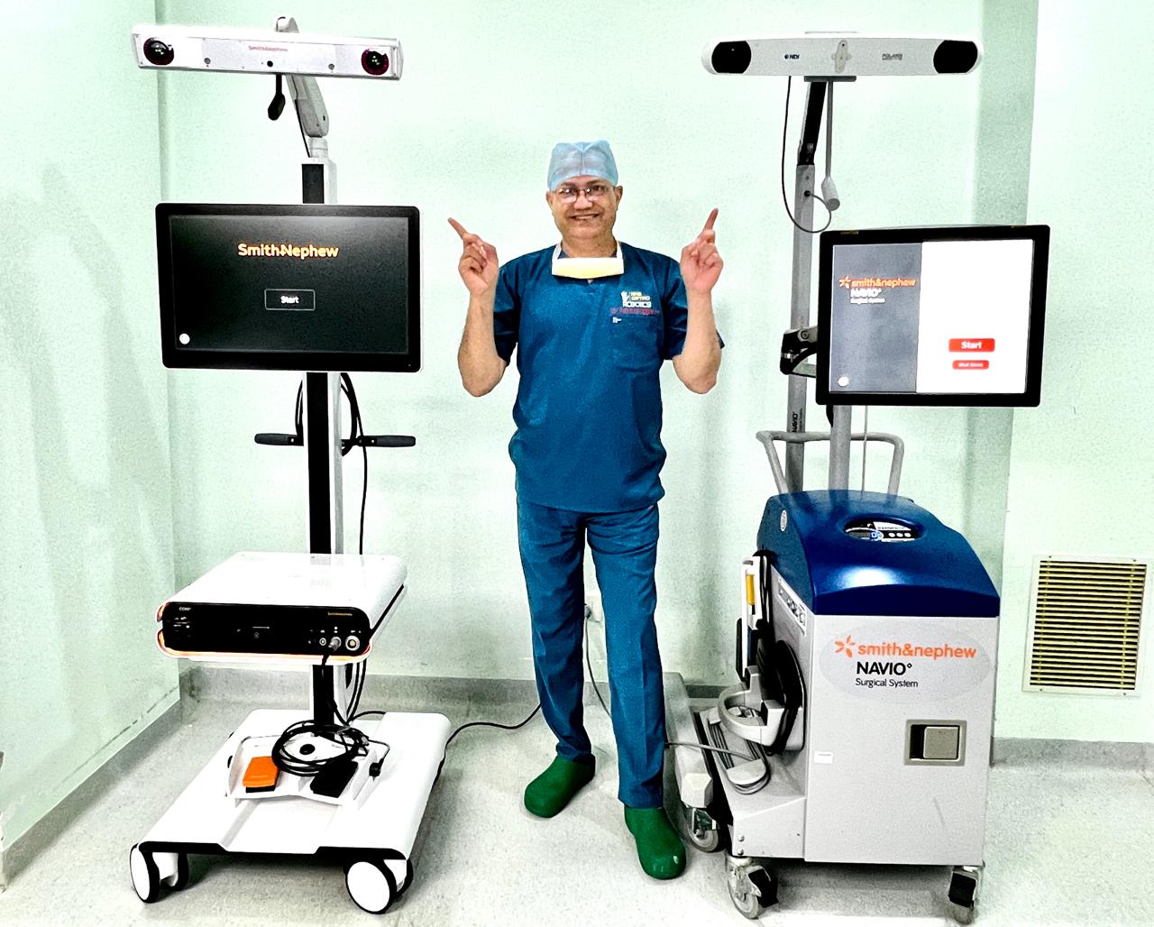 Surgeon beside the NAVIO robotics platform at NHS Hospital